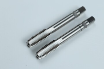 Fototapeta premium a metal-cutting tool designed for cutting or restoring internal threads in pre-drilled holes