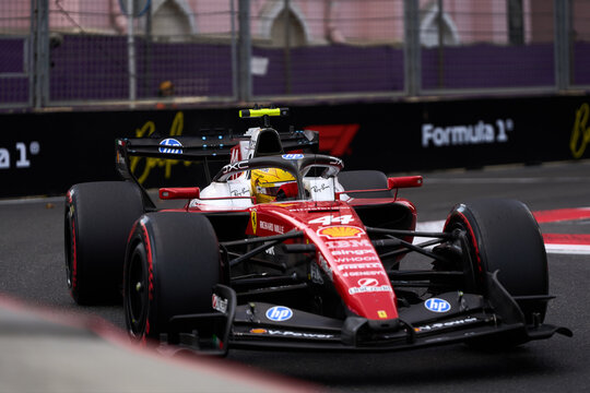 BAKU, AZERBAIJAN - SEPTEMBER 2026: Lewis Hamilton drives the Scuderia Ferrari F1 car #44 past track barriers during the Azerbaijan Grand Prix at Baku City Circuit