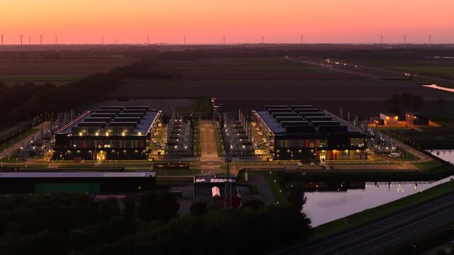 Aerial view of a large data center in Middenmeer at sunset