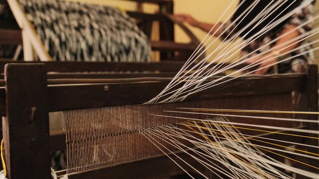 Cham woman works a wooden handloom in Chau Phong, Vietnam