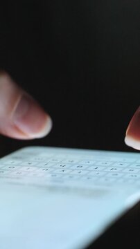Female hands typing text on smartphone close-up.