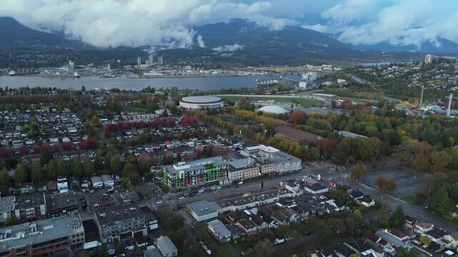 Aerial view showcasing North Vancouver's port and clouds lying on the mountains