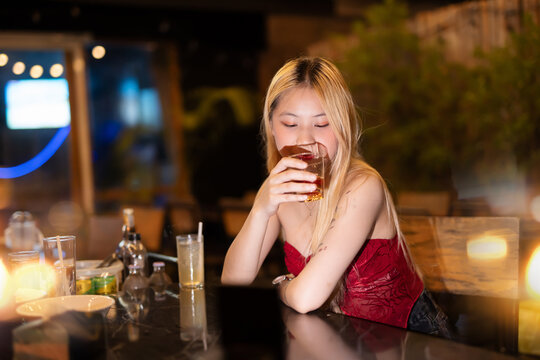 Closeup business woman holding a glass of whiskey