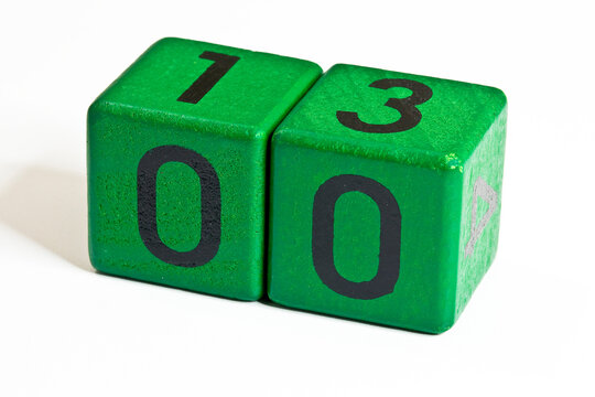 Number zero and thirteen written on a wooden green cube of a calendar date