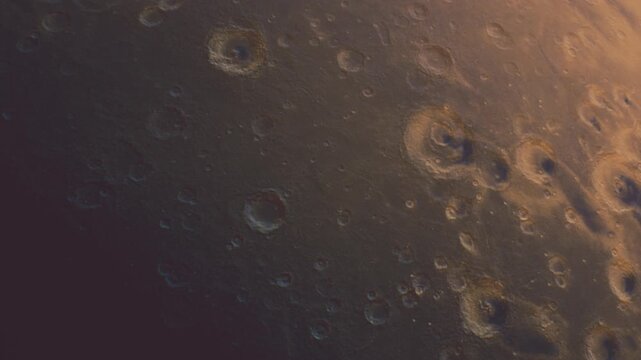 The picture shows the surface of the moon during a clear night. Craters are visible on the moons surface, showing its rocky texture and features. The scene is dark with highlights.