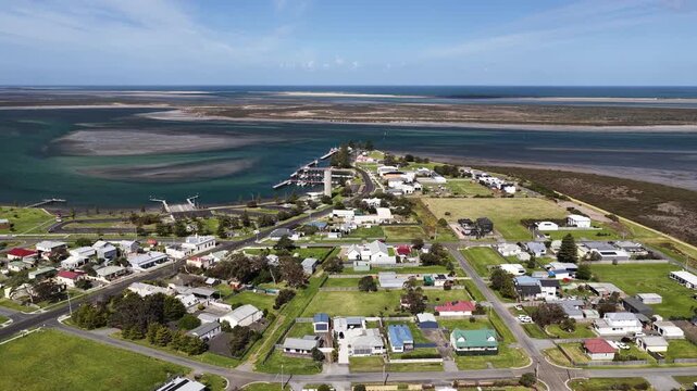 Port Albert, Victoria, Australia &ndash; 4K aerial drone view of historic coastal town, turquoise tidal waterways, marina, extensive sandbars and wetlands along the Gippsland coastline