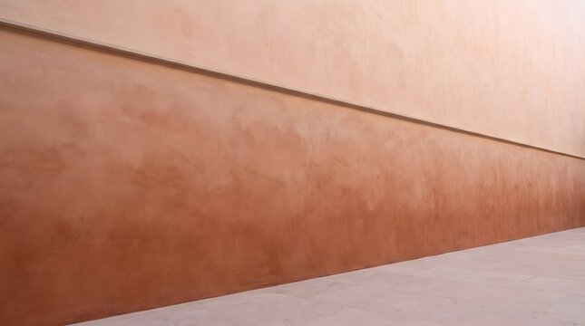 Terracotta wall meets cream stucco surface. Horizontal line divides warm earthy tones. Minimalism creates a calm abstract backdrop