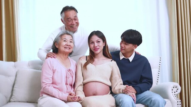 Entire family joyfully preparing welcome new member grandparents are eagerly awaiting arrival little grandchild due enter world few months&rsquo; time everyone is gathered in the living room.