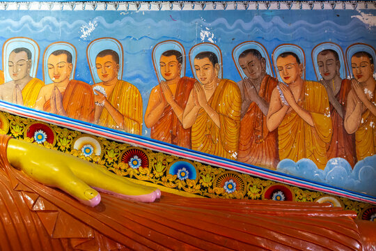 Mural of praying monks above the feet of a reclining Buddha statue, North Central Province, Anuradhapura, Sri Lanka