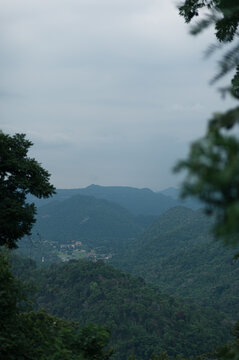 Scenic Mountain View of Yai with Lush Greenery and Overcast Sky