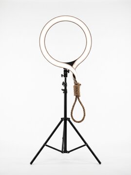 Glowing LED ring light morphing into braided rope noose, live streaming trap and clout chasing scandal concept on white background
