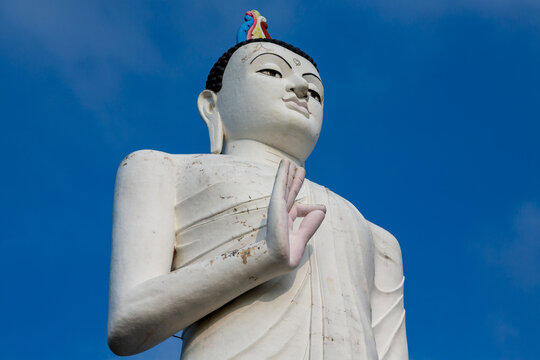Giant white Buddha statue near the foot of Sigiriya Rock Fortress, Central Province, Sigiriya, Sri Lanka