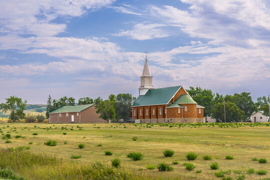 Claybank Historic Brick Church with Green Roof and White Steeple in the Southern Saskatchewan Prairie Landscape