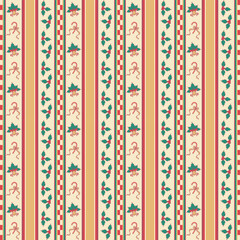 Seamless striped pattern with vintage Christmas ornament. Repeat season greetings wallpaper with holly, bell, and candy cane. © NATTHAPHORN