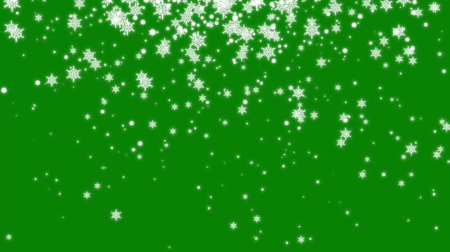 Falling snowflakes and white glowing sparkle particles shower, magical winter snow effect transition on green background loop