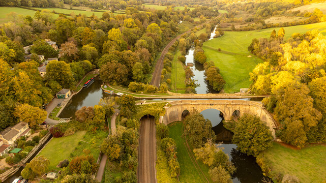 Autumnal aerial view of the historic Avoncliff Aqueduct in England.
