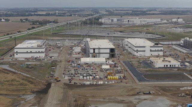 Aerial view of hyper scale data center and building centers with electrical substation and construction by interstate 71 i71 highway between Columbus and Cincinnati Ohio for big technology company AI