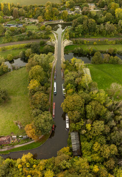 Boats traverse the historic Dundas Aqueduct in the English autumn.