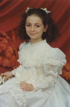 Retro Studio Portrait of a Girl in a White Dress