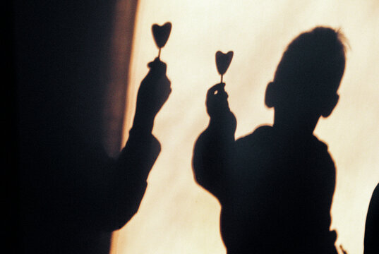 Shadow with heart shaped lollipops