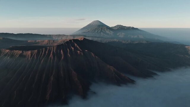 Tosari, East Java, Indonesia - 02 August 2026: Aerial view of Mount Bromo volcanic landscape with rugged craters and morning mist.