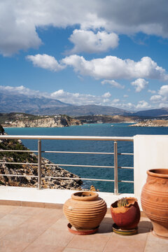 balcony with traditional clay pots and a view to Mediterranean sea