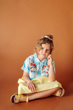 Girl with thoughtful expression looking at camera