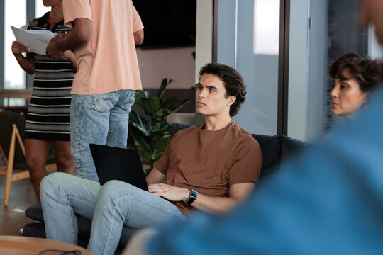 Attentive colleagues listen during an open discussion