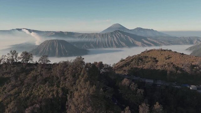 Tosari, Indonesia - 02 August 2026: Aerial view of Mount Bromo with volcanic craters, mist, and rugged landscape in East Java.