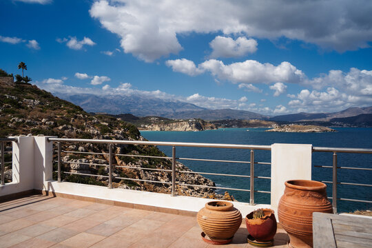 balcony with traditional clay pots and a view to Mediterranean sea