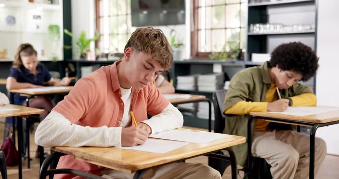 Cheating, test or boy in class with writing, student dishonesty or discipline issue in school rules. Education, unfair or teenager with exam, academic copy or peeking secret in behavior challenge.