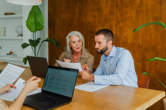 Colleagues analyzing document together