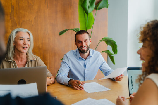 Diverse team smiling during brainstorming session
