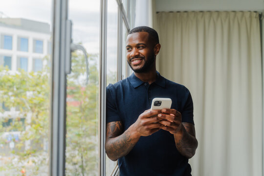 Male entrepreneur holding phone