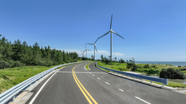 Coastal highway with wind turbines