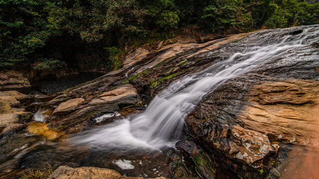 Small mountain stream waterfall in forest