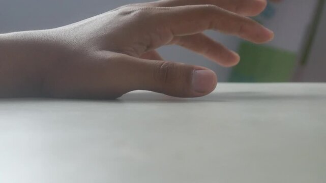 Close up hand fingers tapping guard