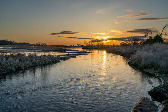 springtime sunrise over wide and shallow Platte River near Kearney, Nebraska