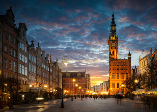 Street in an Old town and Town Hall in Gdansk, Poland. Panoramic evening view, long exposure, timelapse.  Historical city of Gdansk (Danzig) , Poland, Europe.