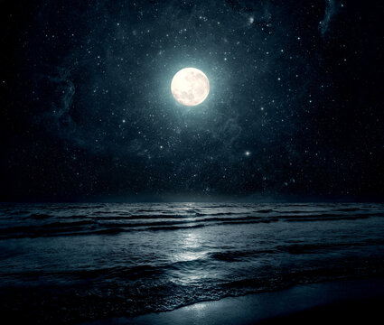Moon over sea or ocean. Night view. A good background for the theme of travel, vacation, voyage. Moonlight background.