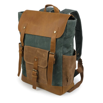 Three quarter view of a rugged green canvas backpack with brown leather trim and pockets