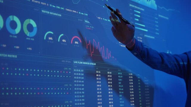 Business professionals analyzing complex data on a futuristic holographic digital display for strategic planning and innovation