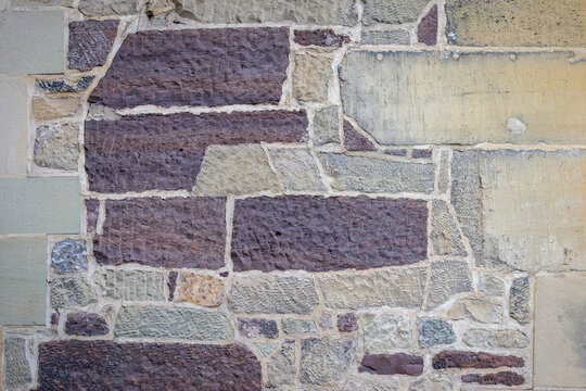 Rustic Multicolored Sandstone Wall Texture Background with Irregular Stone Blocks