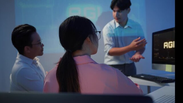 Asian business team brainstorming artificial general intelligence project in a late night office meeting