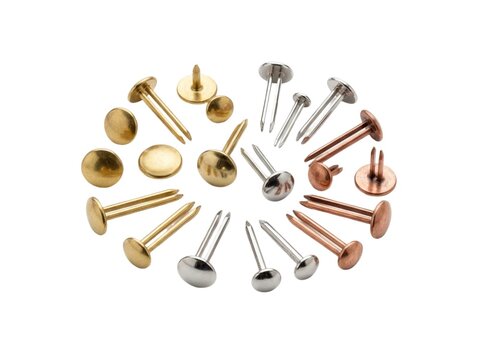 Various metallic split pins arranged in circular formation against bright white background studio lighting