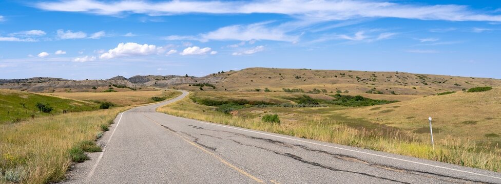 Panorama of the meadows and buttes along Highway 91 between St X