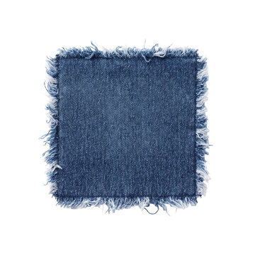 Blue denim fabric patch with frayed edges isolated
