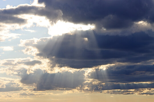 Sun rays through evening clouds