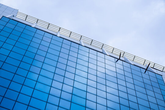 Modern glass skyscraper facade close up