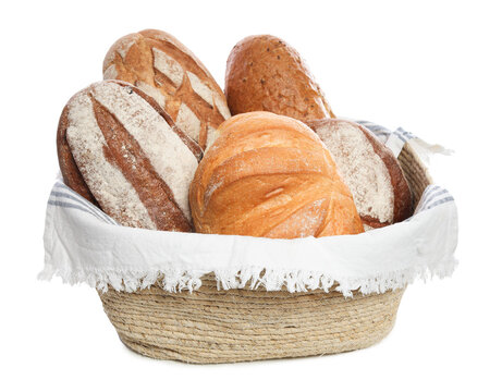Different types of bread in wicker basket isolated on white